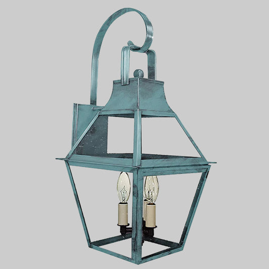 Vintage-style metal lantern with two light bulbs on a gray background
