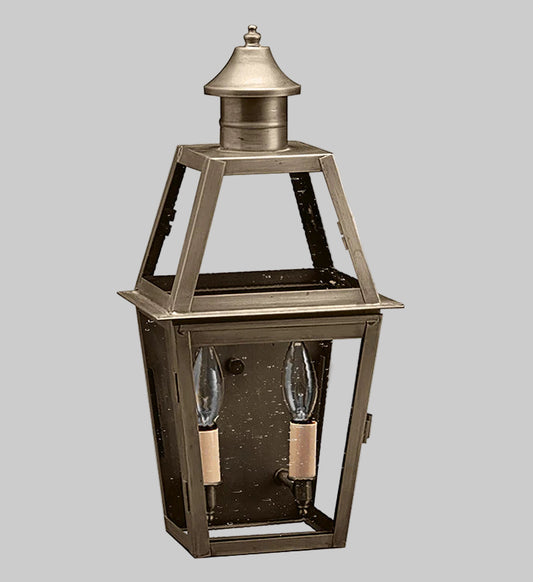 Decorative outdoor lantern with two light bulbs on a gray background