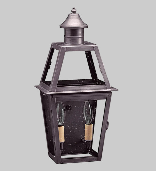 Decorative outdoor lantern with two light bulbs on a gray background
