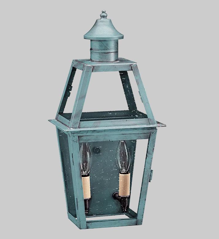 Decorative outdoor lantern with two candle holders on a gray background