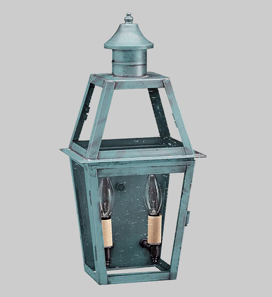 Decorative outdoor lantern with two candle holders on a gray background