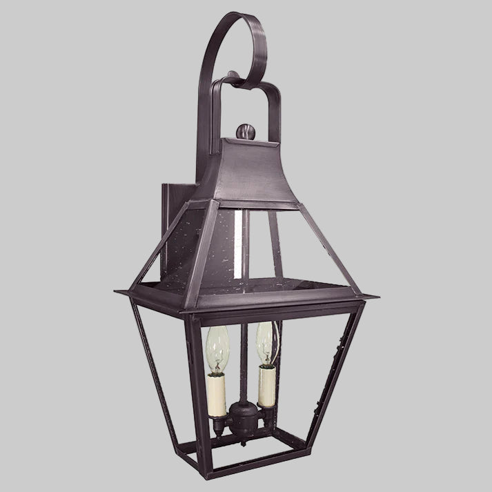 Decorative outdoor wall light fixture on a gray background