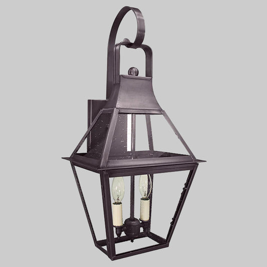 Decorative outdoor wall light fixture on a gray background