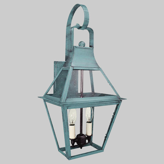 Decorative outdoor lantern with a metal frame on a gray background