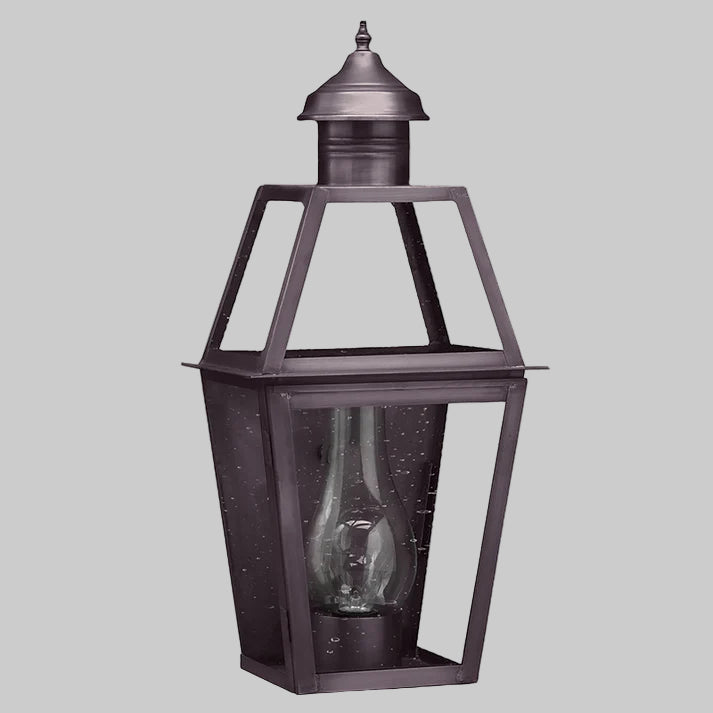 Decorative outdoor lantern with clear glass on a white background