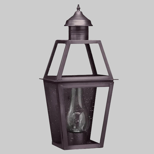Decorative outdoor lantern with clear glass on a white background