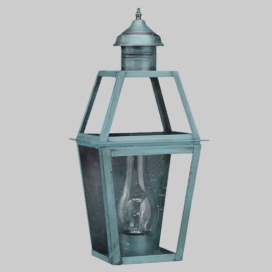 Vintage-style lantern with a verdi gris finish on a white background
