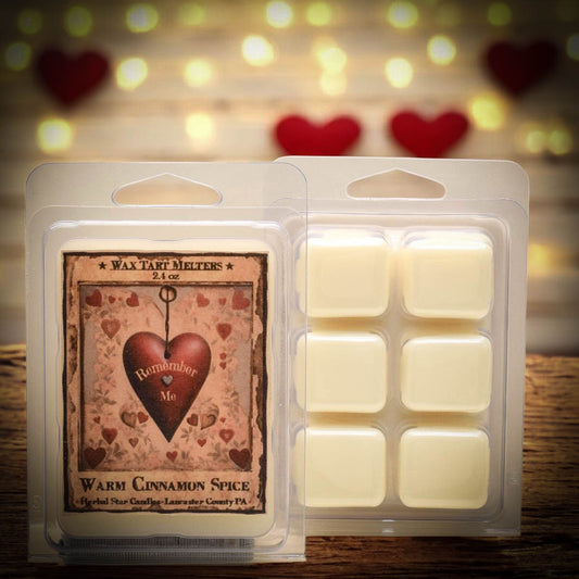 Clear packaging of wax tart melters with artwork of a heart and text