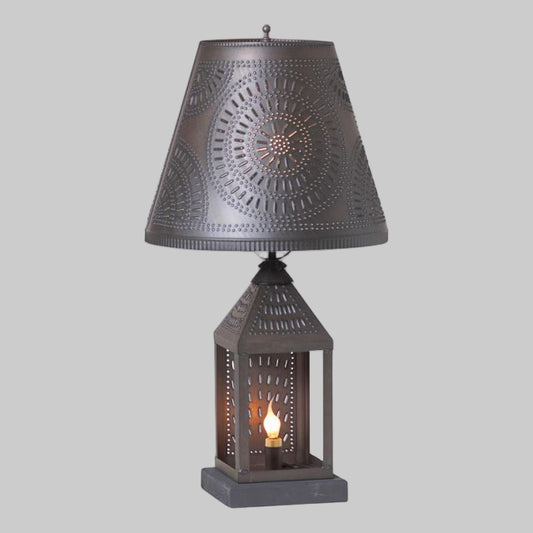 Tin table light with shade on cream background