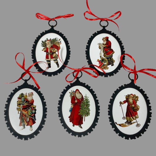 A set of 5 circular Victorian Santa Claus ornaments with red ribbon hangers. Each ornament features a vintage illustration of Santa Claus in a colorful outfit, surrounded by a black matte board border.
