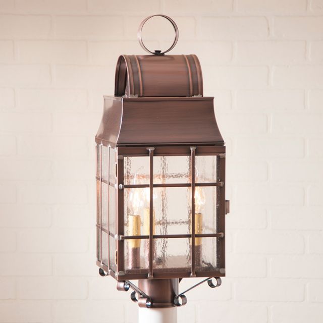 Bronze outdoor lantern with clear glass on a white background