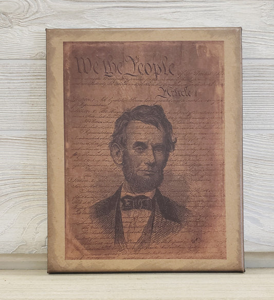 Framed portrait of a historical figure on a textured background