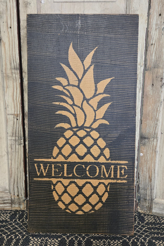 Comb painted sign with pineapple motif and the word 'WELCOME'