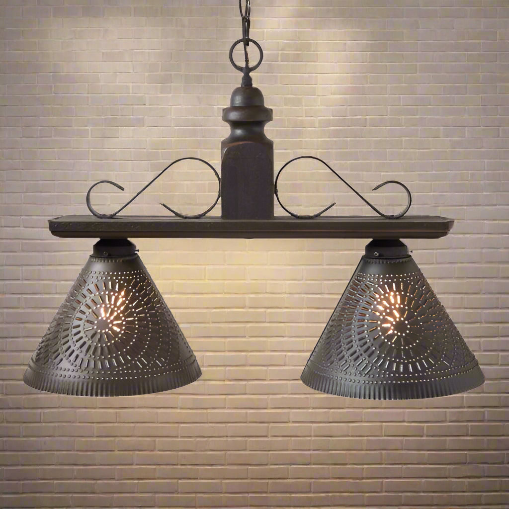 Wooden island pendant light with two punched tin shades in black finish.
