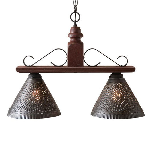 Two light pendant light with punched tin shades in plantation red finish.