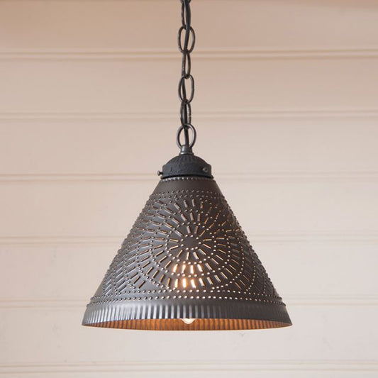 Decorative pendant light with intricate design on a neutral background