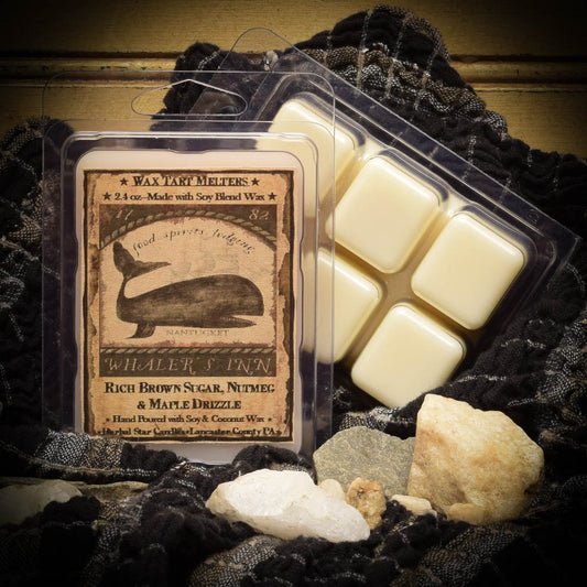 Wax tart melts in a clear packaging with a label on a textured surface.