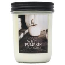 Candle with a label indicating 'White Pumpkin' on a white background