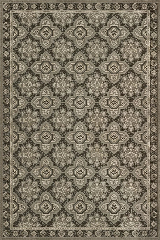 A rectangular floor cloth with a geometric pattern in a color scheme that includes beige and darker beige tones.