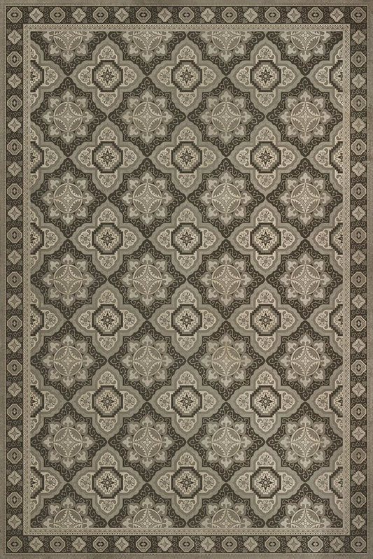 A rectangular floor cloth with a geometric pattern in a color scheme that includes beige and darker beige tones.