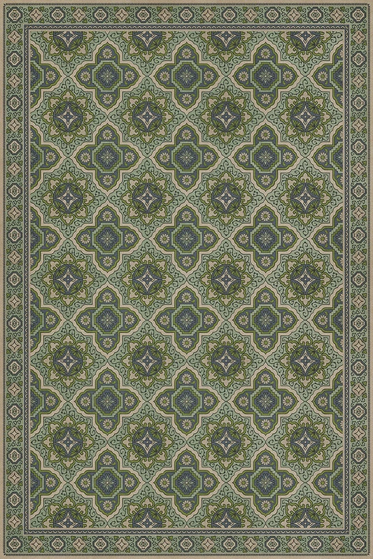 A 24x36 inch vinyl floor cloth with a green floral pattern and a border.