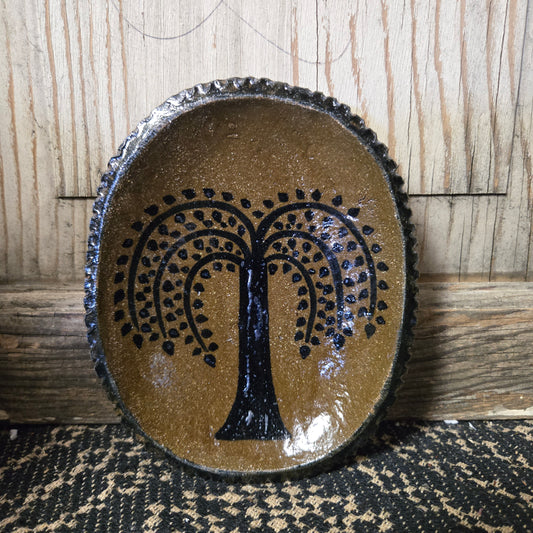 Small, oval stoneware plate with a willow tree motif
