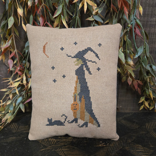 Decorative pillow with a fish design on a textured background
