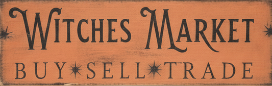 Wooden sign with 'Witches Market' and 'Buy Sell Trade' text on a rustic background