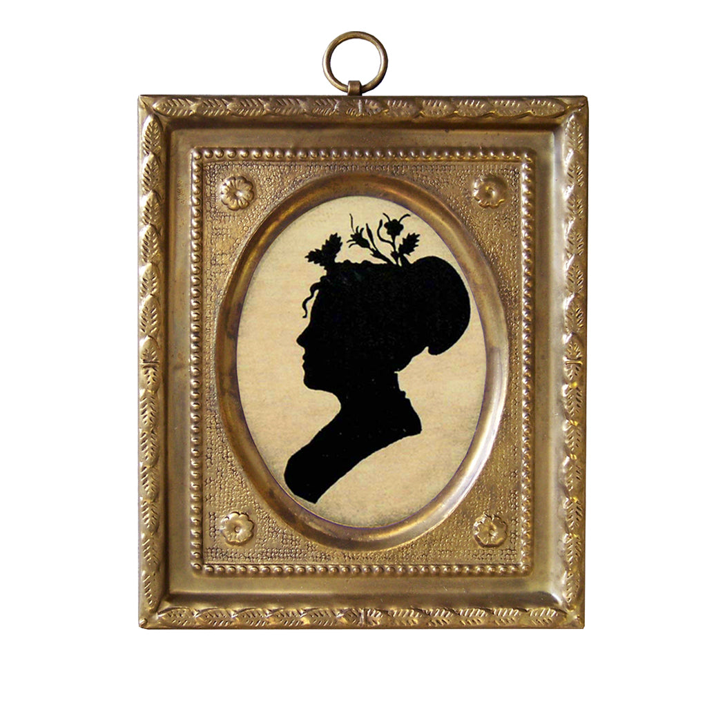 A silhouette of a woman's head and neck within an embossed brass frame, featuring floral elements in the hair.