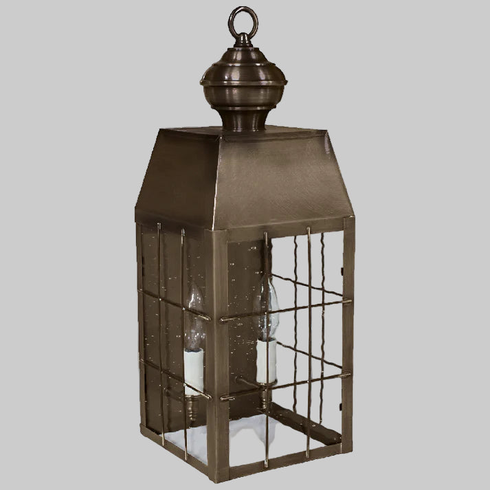 Bronze lantern with glass panels on a white background