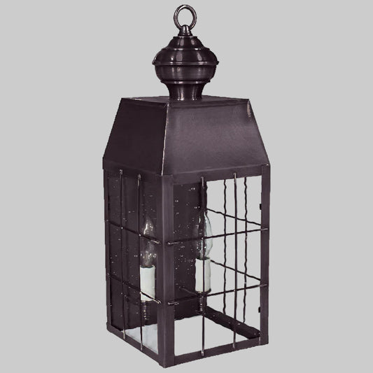 Decorative black lantern with glass panels on a white background