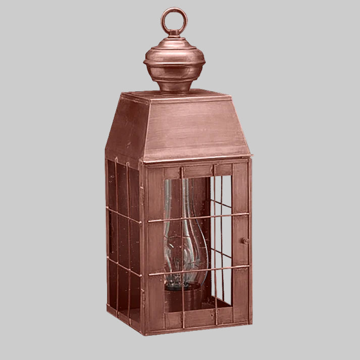 Copper lantern with a clear glass shade on a white background