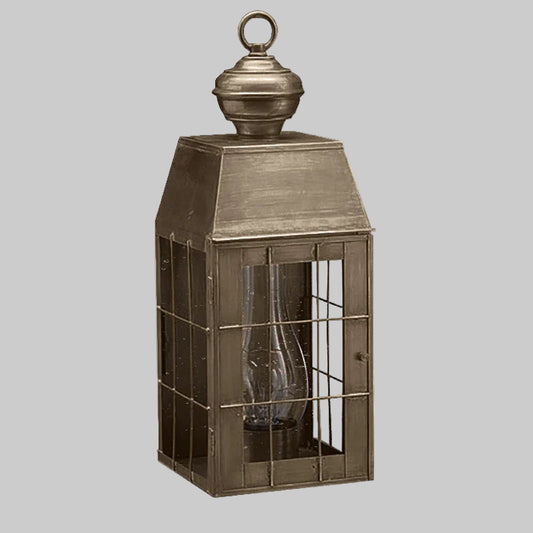Bronze lantern with glass panels on a white background