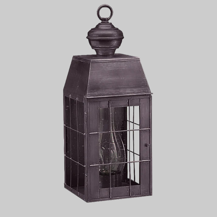 Decorative metal lantern with glass panels on a white background