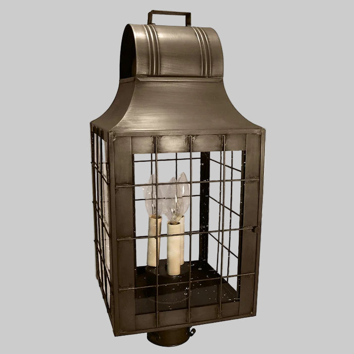 Decorative outdoor lantern with metallic finish on a white background
