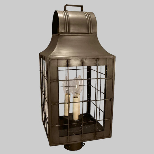 Decorative outdoor lantern with metallic finish on a white background