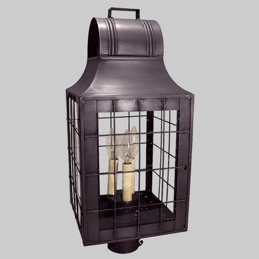 Decorative outdoor lantern with metal cage on a white background
