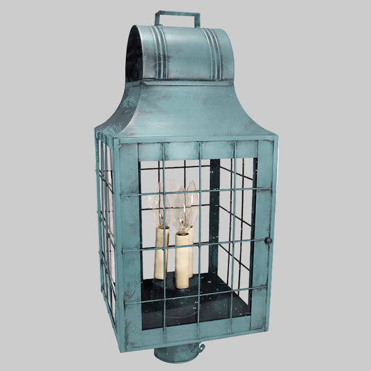 Vintage-style teal lantern with glass panels on a white background