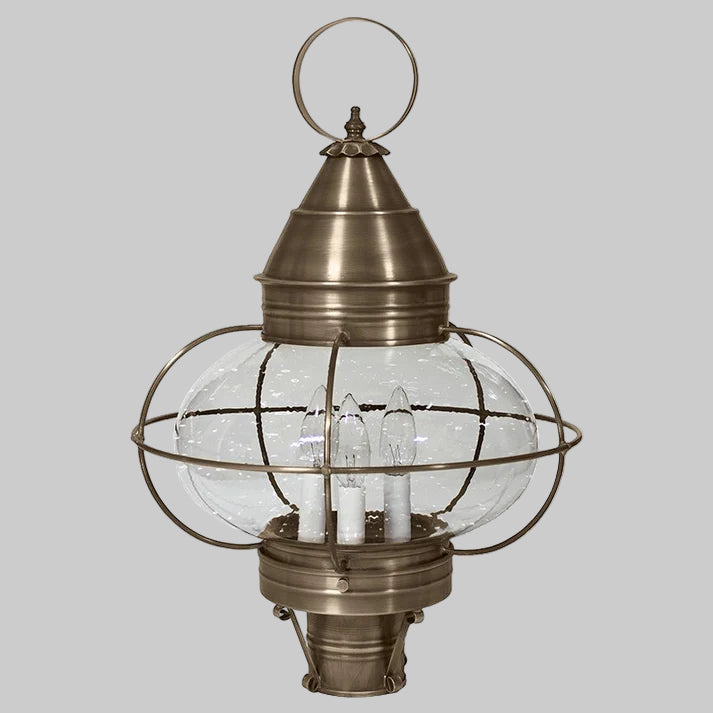 Bronze outdoor lantern with clear glass shade on a white background
