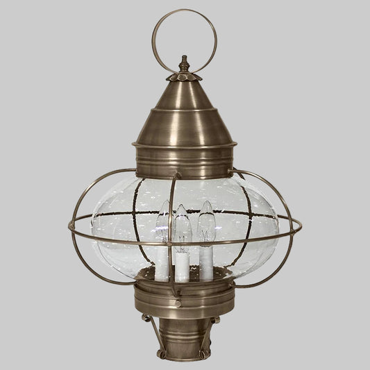 Bronze outdoor lantern with clear glass shade on a white background