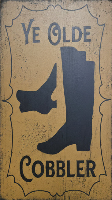 Doormat with 'Ye Olde Cobbler' text and shoe silhouette on a wooden background