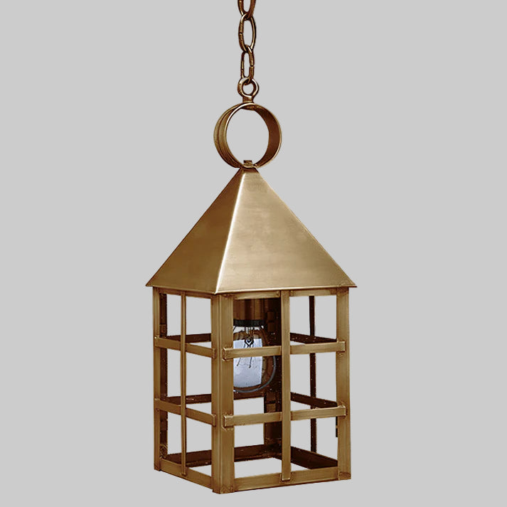 Brass hanging lantern on a gray background