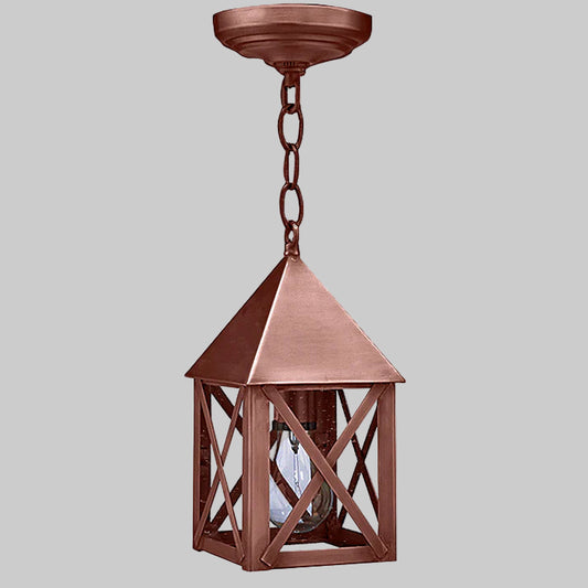 Copper pendant light fixture on a gray background