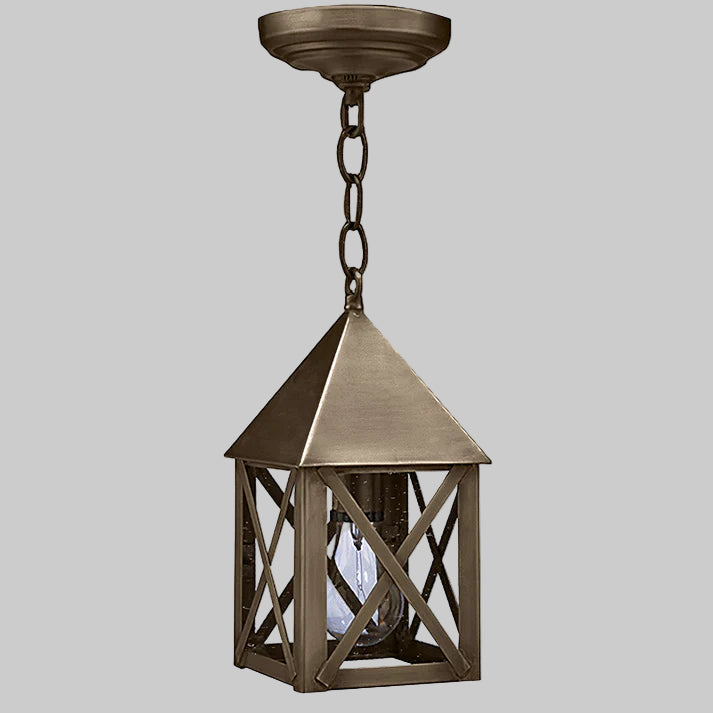 Bronze pendant light fixture on a gray background
