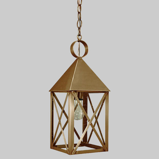 Gold hanging lantern with a clear bulb on a gray background
