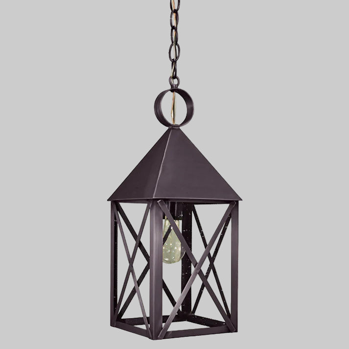 Black metal hanging lantern on a gray background