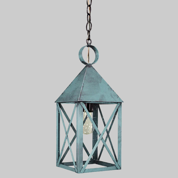 Decorative hanging lantern with a rustic design on a gray background
