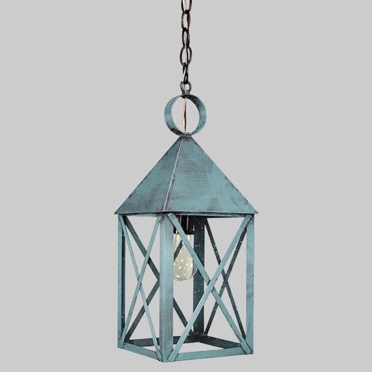 Decorative hanging lantern with a rustic design on a gray background
