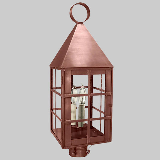 Copper outdoor lantern with a gray background