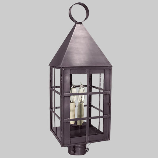 Decorative outdoor lantern with glass panels on a gray background